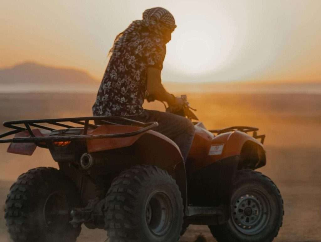 "Sunrise quad bike safari in Luxor desert with view of temples and Nile"