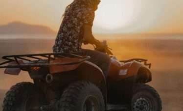 "Sunrise quad bike safari in Luxor desert with view of temples and Nile"